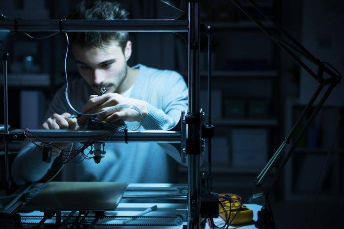 young male engineer working in lab