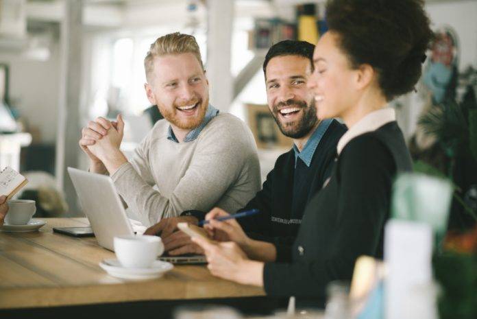 Employees laughing and smiling