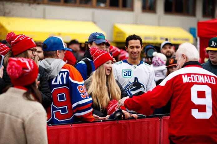 An excited fan meets NHL alumnus Lanny McDonald at Scotiabank Hockey Day in Canada - Victoria 2024. Photo: Jay Wallace.